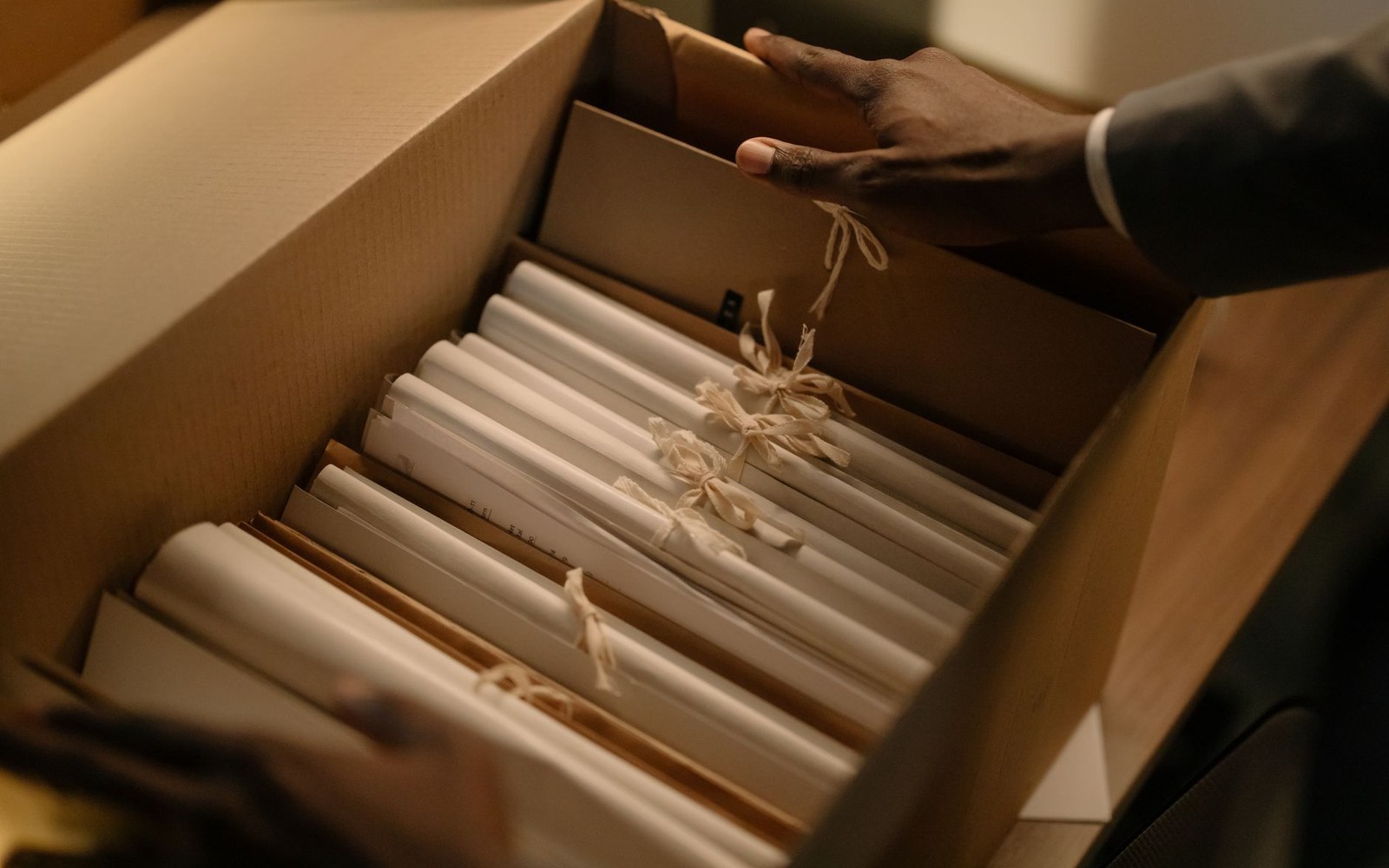 a library box of pamphlets sorted into paper dividers