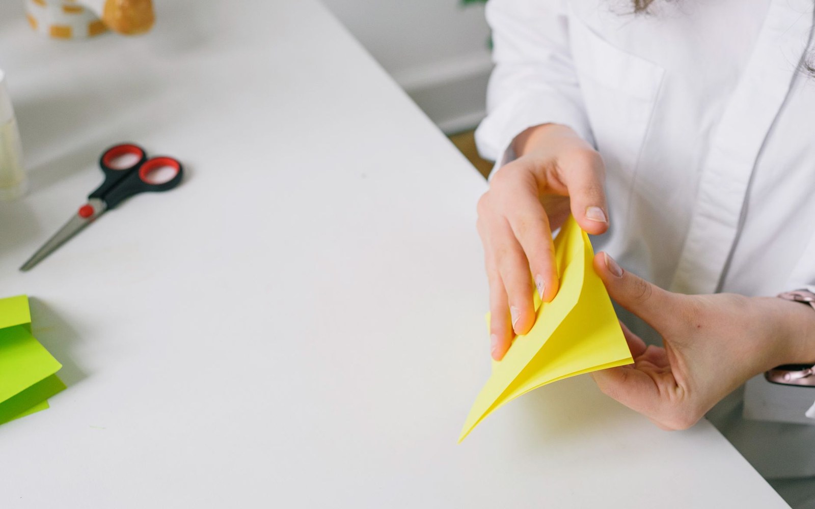 ink-stained hands folding at a table
