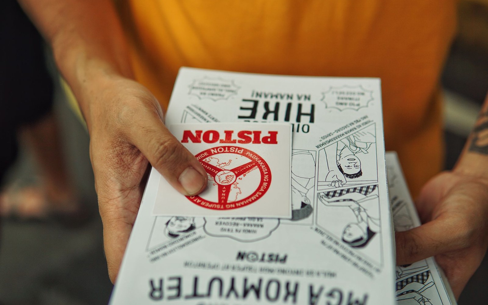 a stack of folded half-letter zines